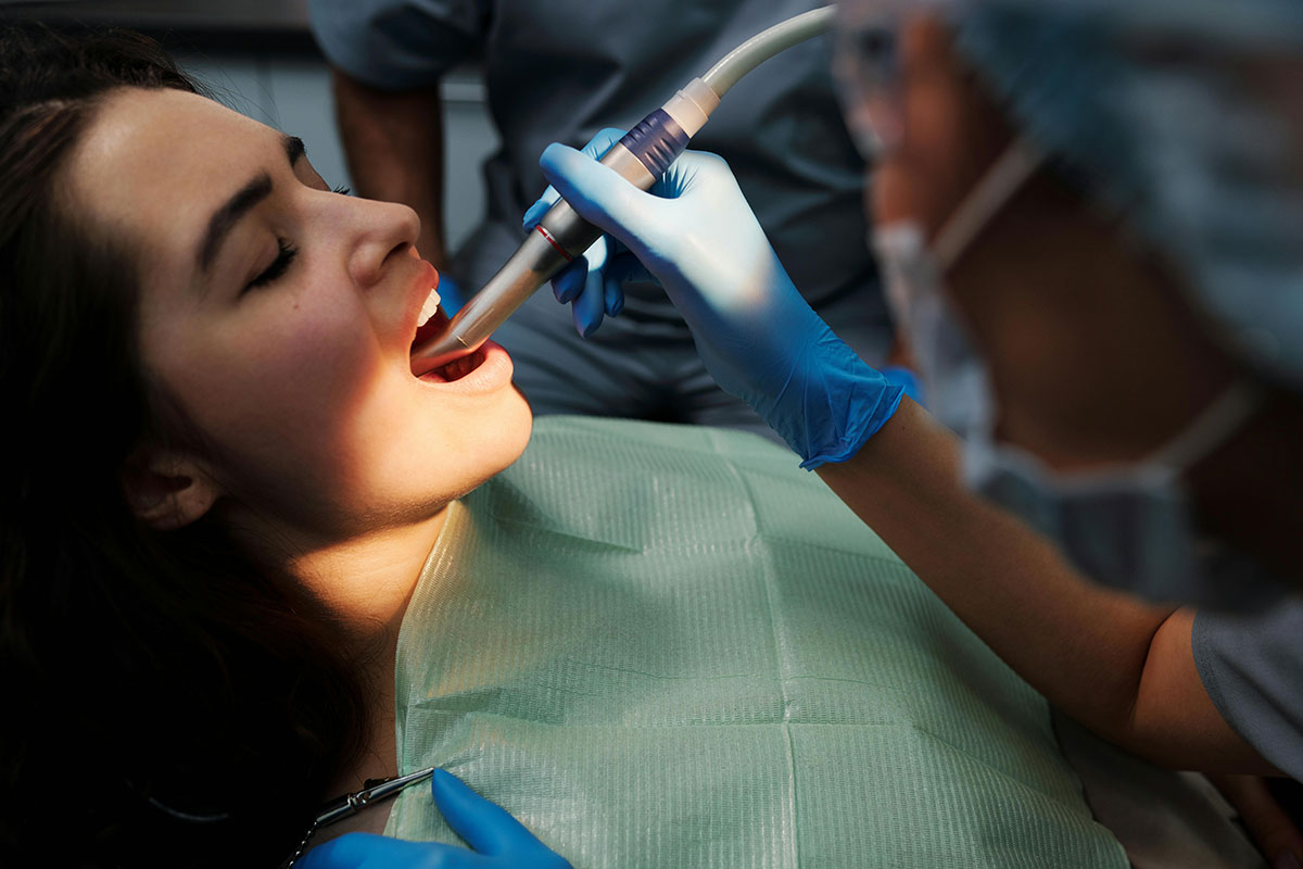 Patient getting a deep dental cleanin