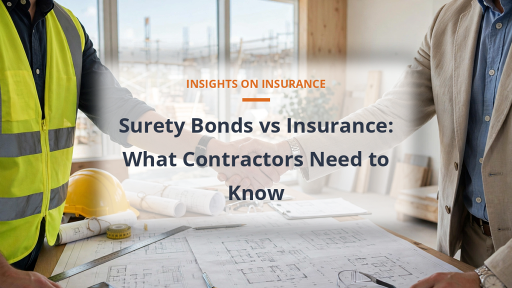 Surety bonds vs insurance - handshake at construction site office with blueprints