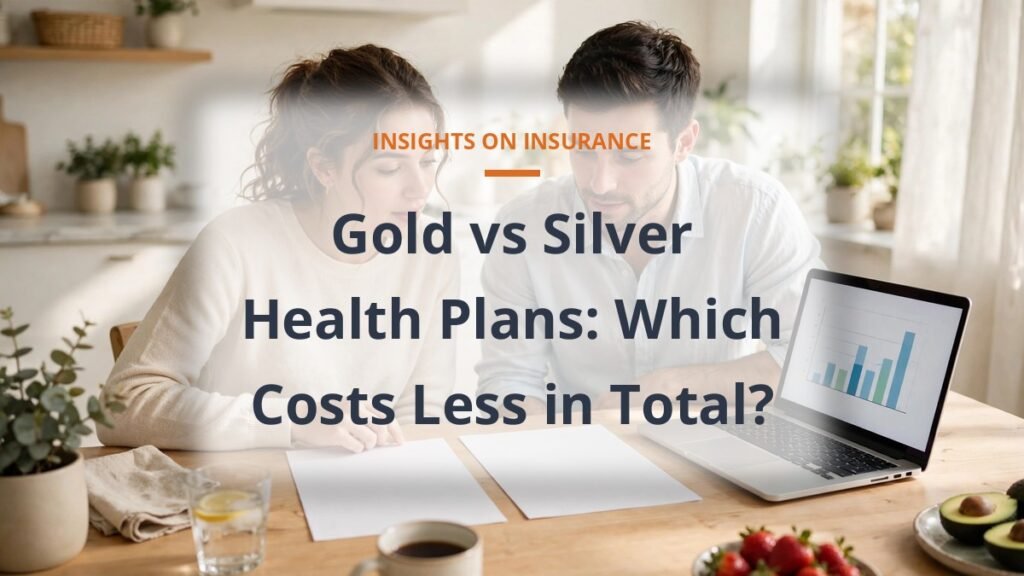 Couple comparing gold vs silver health plan costs at a kitchen table with a laptop