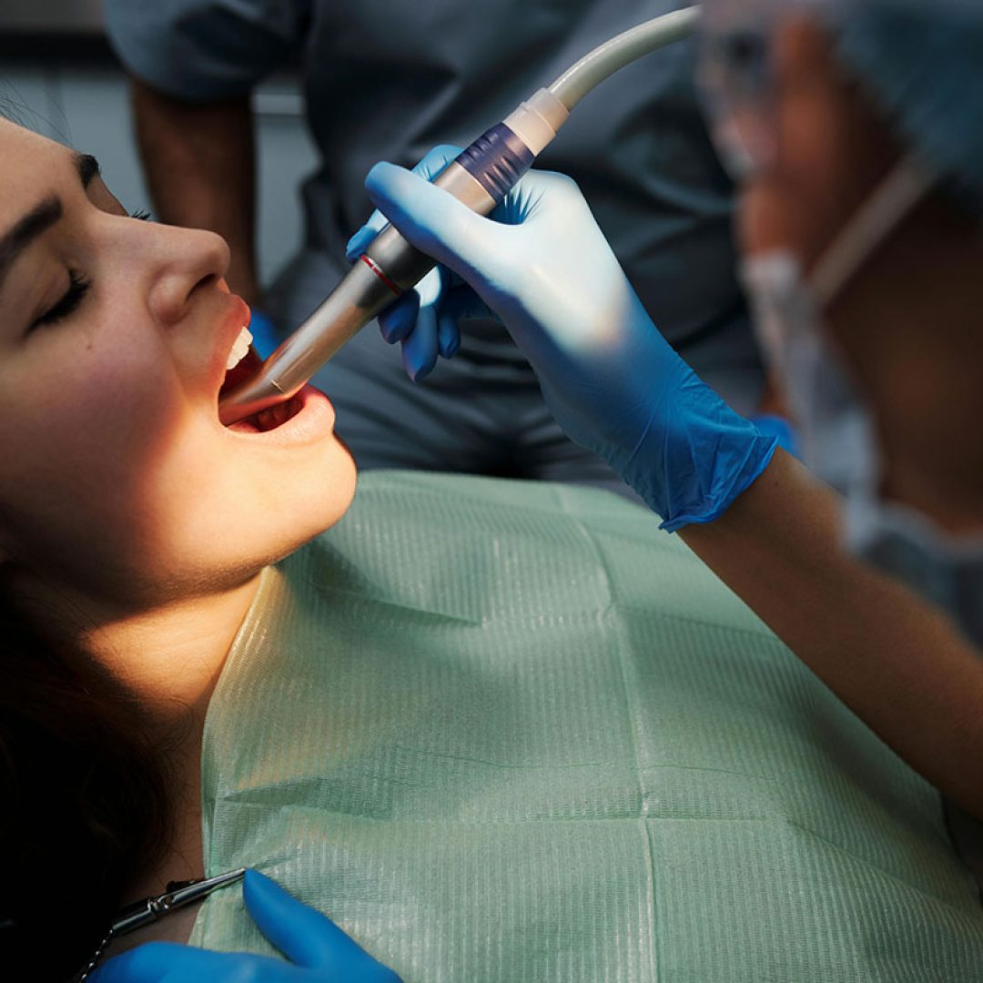 Patient getting a deep dental cleanin